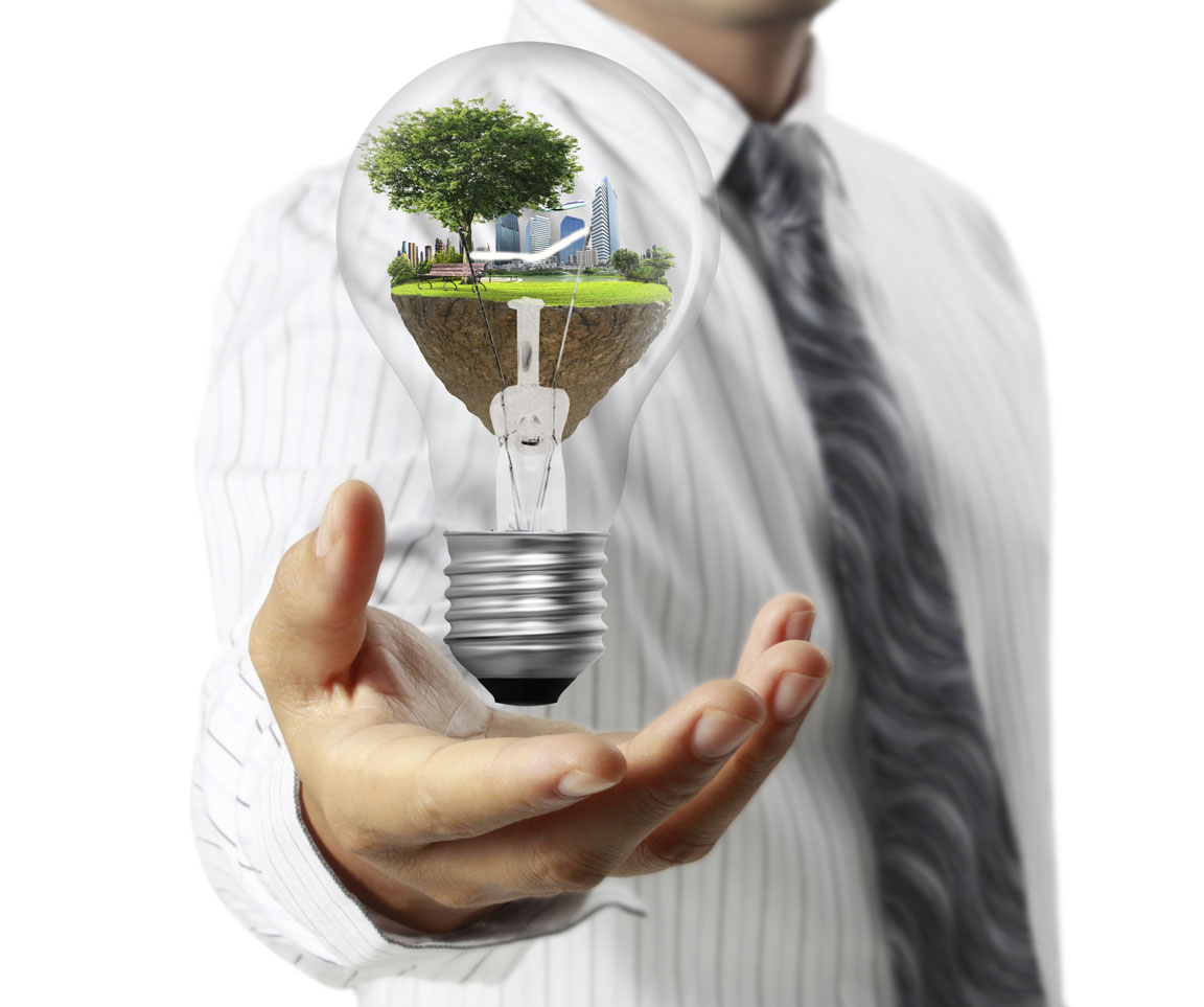 businessman holding lightbulb representing sustainable energy