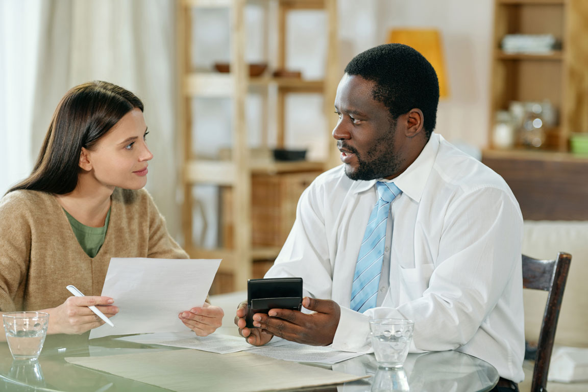 man and woman discussing small business loan