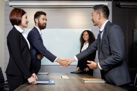business-meeting-of-young-colleagues business owners shaking hands