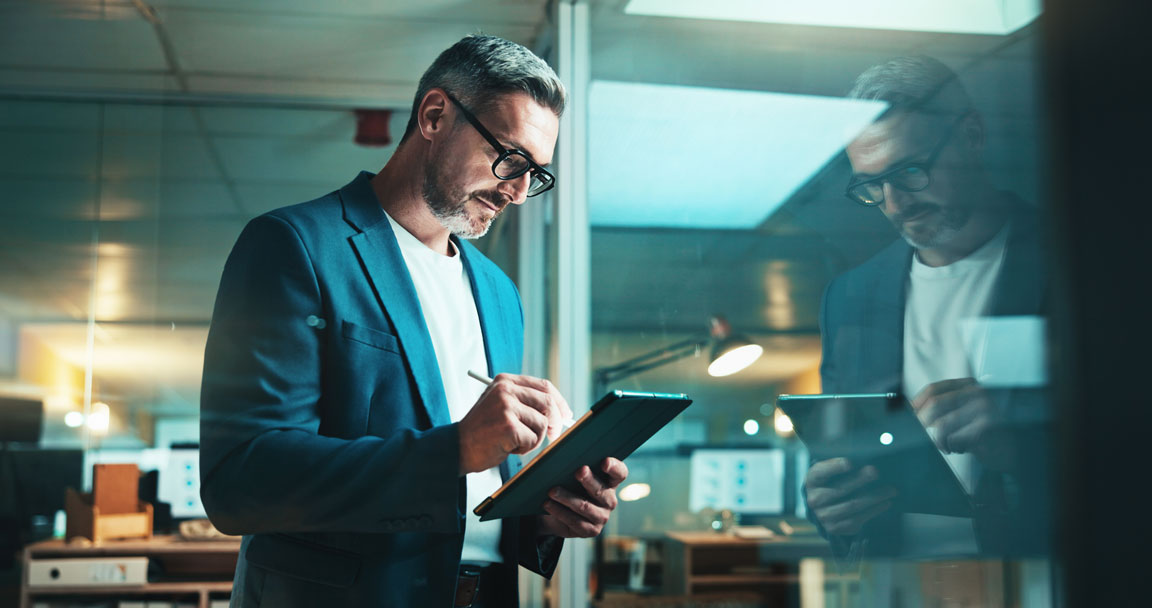 focused businessman on tablet