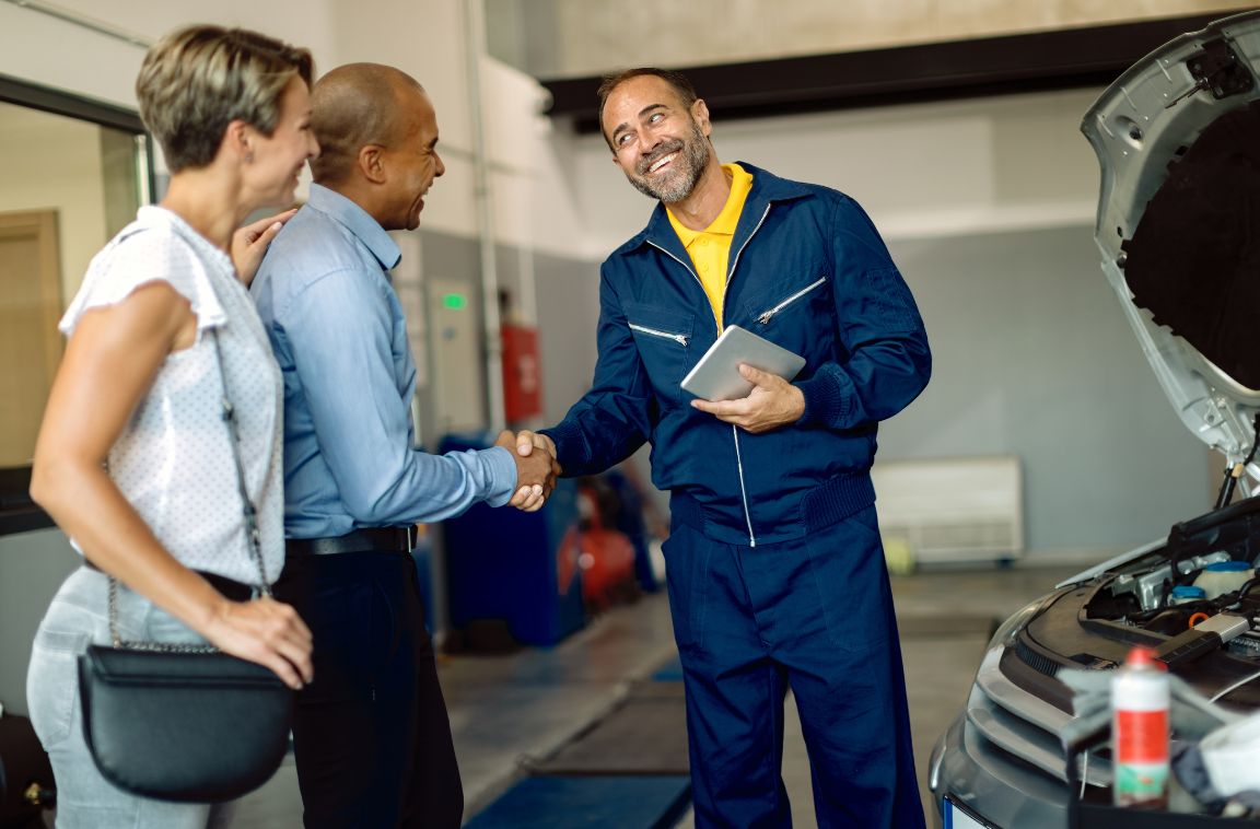 business owner shaking a customer's hand