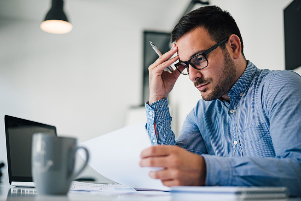 stressed businessman at desk