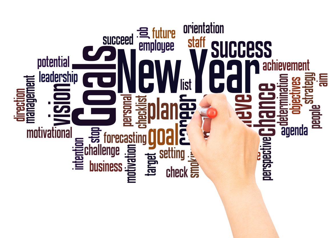 new-year-goals-word-cloud-and-hand-with-marker New Year business planning